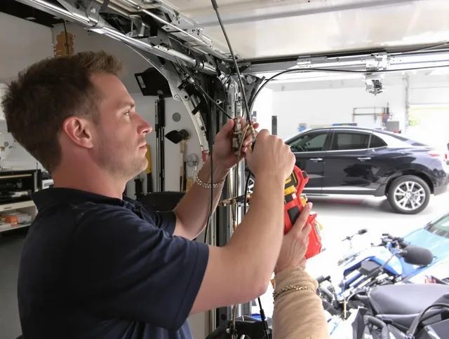 Solon Garage Door Repair safety certified technician performing cable replacement in Solon