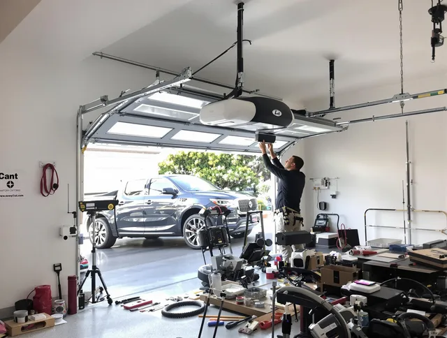 Solon Garage Door Repair specialist installing smart garage door opener system in Solon home