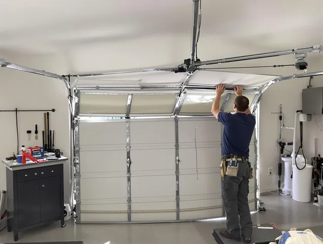 Solon Garage Door Repair specialist performing precise section replacement on Solon garage door